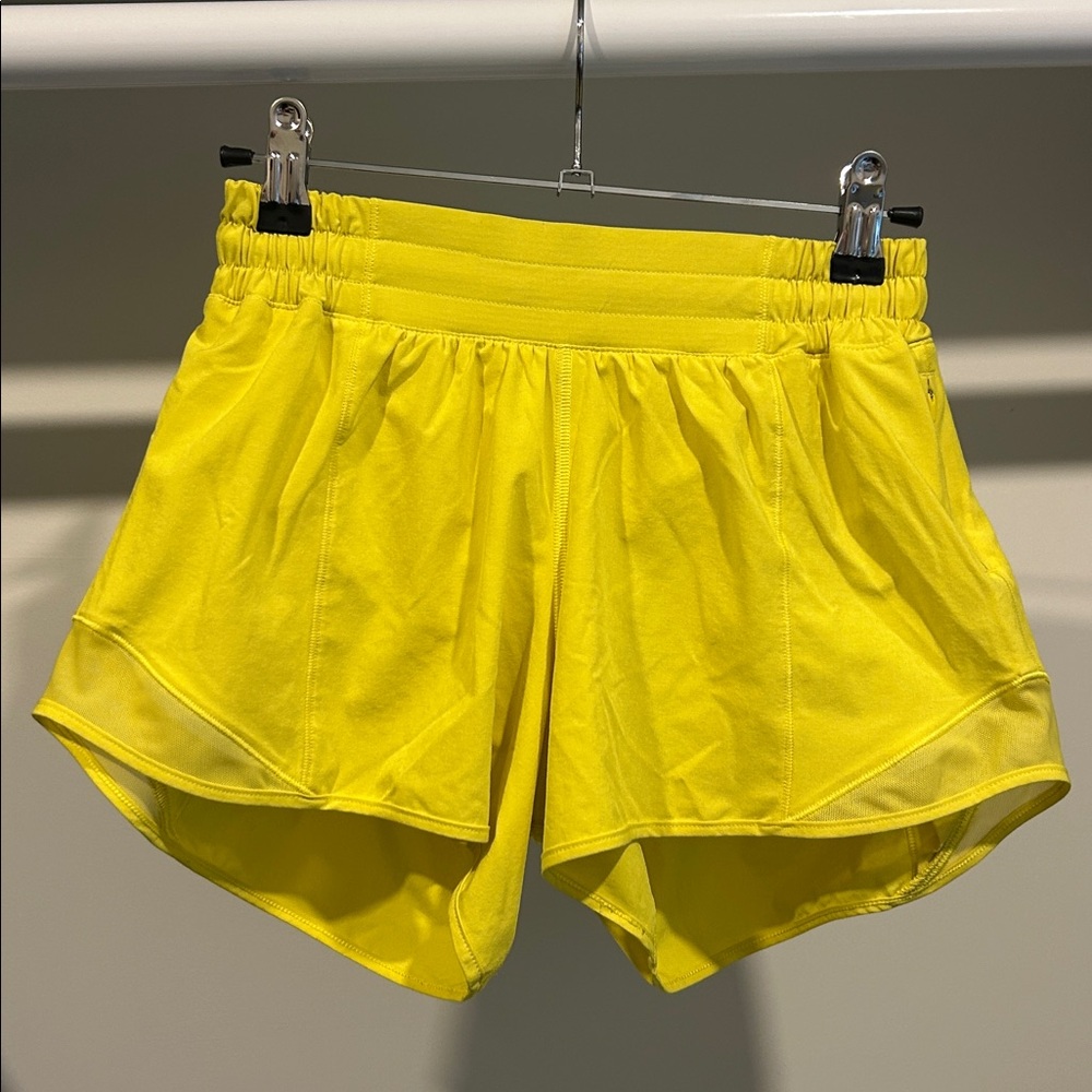 Lululemon Hotty Hot 4 inch shorts. Size 4. Bright yellow color. Good condition